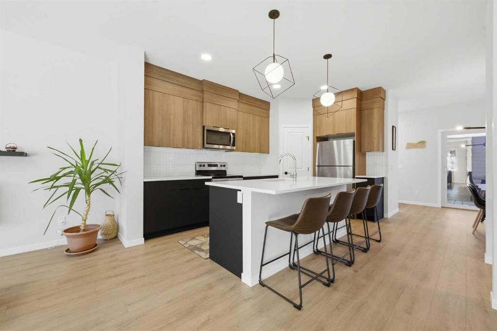 Bright kitchen with island and warm wood cabinetry